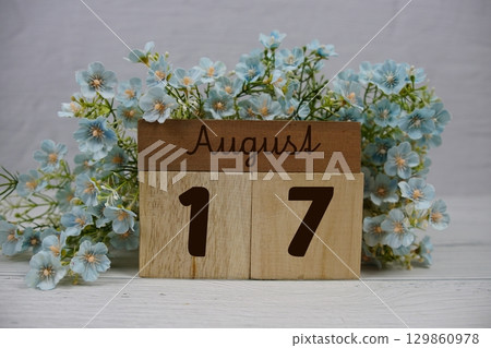 Wooden Calendar Showing the Date of August 17th. Day 17 of August month 129860978
