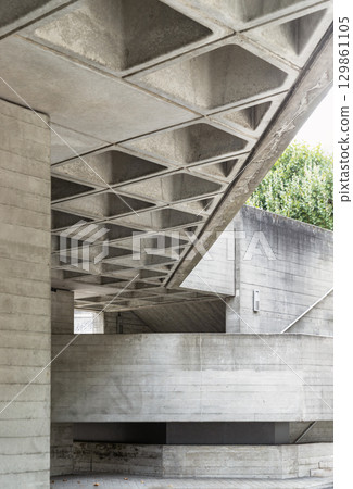 the Brutalist architectural structure is part of the National Theatre in London. a prominent cultural institution by its extensive use of exposed concrete, geometric forms, and robust, monumental the Brutalist architectural structure is part of the National Theatre in London. a prominent cultural institution by its extensive use of exposed concrete, geometric forms, and robust, monumental 129861105