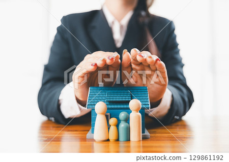 Home insurance and security concept. Real estate house insurance. Domino chain challenge risk. insurance risk management, property security, financial planning to safety, mortgage protect investment 129861192