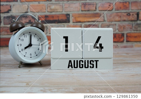 Wooden Calendar Showing the Date of August 14th. Day 14 of August month 129861350