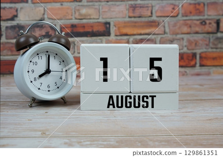 Wooden Calendar Showing the Date of August 15th. Day 15 of August month 129861351
