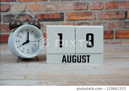 Wooden Calendar Showing the Date of August 19th. Day 19 of August month Wooden Calendar Showing the Date of August 19th. Day 19 of August month 129861355