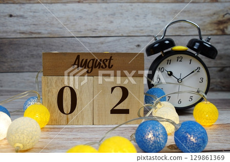 Wooden Calendar Showing the Date of August 2nd. Day 2 of August month 129861369
