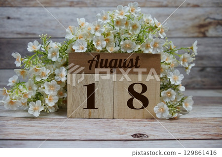 Wooden Calendar Showing the Date of August 18th. Day 18 of August month 129861416