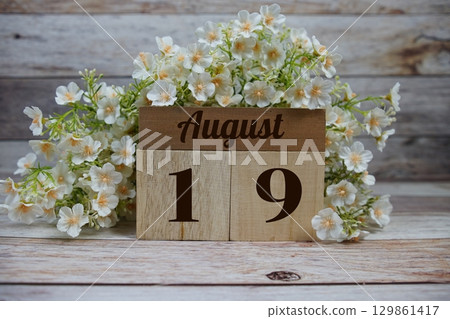 Wooden Calendar Showing the Date of August 19th. Day 19 of August month 129861417