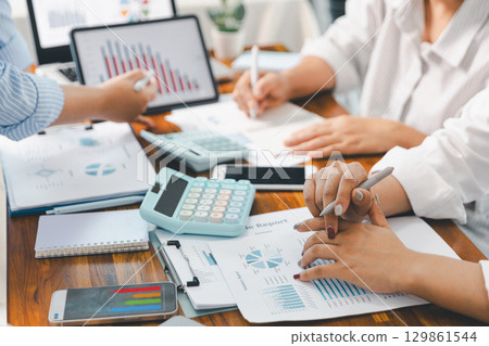 Financial business team in office, financial expert analyze business report graph and finance chart at corporate office. Concept of finance economy, banking business and stock market research. 129861544