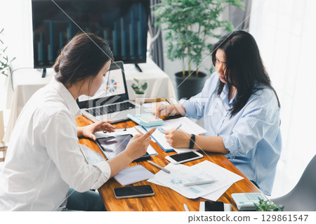 Teamwork meeting, business people in office workplace. Collaboration, technology and worker, employees with touchscreen planning sales, research or financial strategy, staff for conversation, graph 129861547