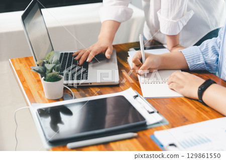 Teamwork meeting, business people in office workplace. Collaboration, technology and worker, employees with touchscreen planning sales, research or financial strategy, staff for conversation, graph 129861550