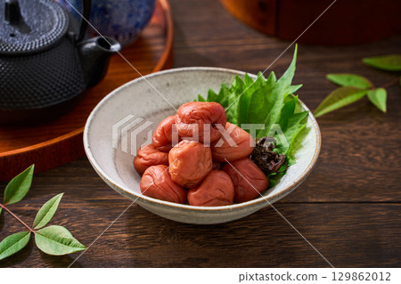 Small bowl of pickled plums | A staple of Japanese cuisine: pickles and preserved foods 129862012