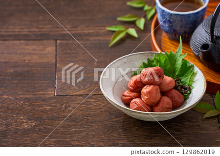 Small bowl of pickled plums | A staple of Japanese cuisine: pickles and preserved foods 129862019