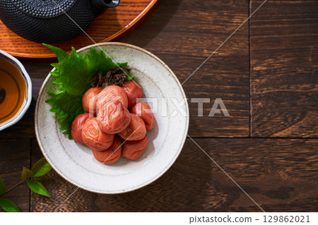 Small bowl of pickled plums | A staple of Japanese cuisine: pickles and preserved foods 129862021