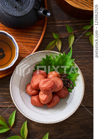 Small bowl of pickled plums | A staple of Japanese cuisine: pickles and preserved foods 129862026