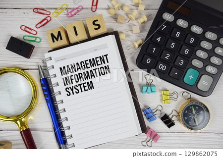 MIS Management Information System acronym on notepad, Business concept background 129862075