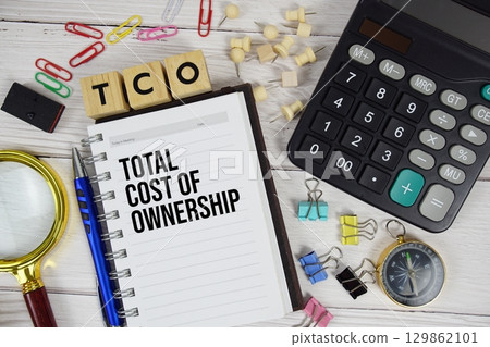 TCO Total Cost of Ownership acronym on notepad, Business and Financial concept background 129862101