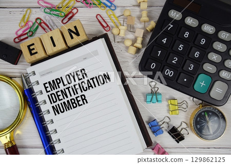EIN Employer Identification Number acronym on notepad, Business and Financial concept background 129862125