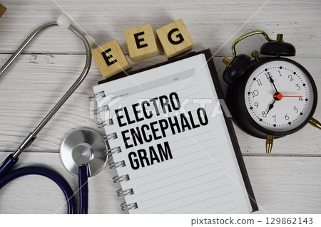 EEG Electroencephalogram acronym on notepad, Healthcare and Medical concept background EEG Electroencephalogram acronym on notepad, Healthcare and Medical concept background 129862143