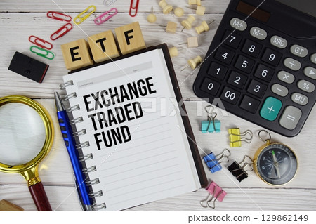 ETF Exchange Traded Fund acronym on notepad, business and financial concept background ETF Exchange Traded Fund acronym on notepad, business and financial concept background 129862149