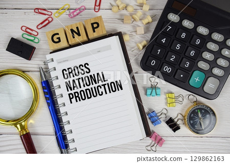 GNP - Gross National Production acronym on notepad, business and financial concept background 129862163