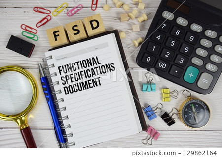 FSD - Functional Specifications Document acronym on notepad, business and financial concept background 129862164