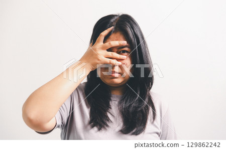 Asian girl expresses dislike, person express negative feeling, concept business complaint from customer ensuring employee satisfaction negative feedback to prevent mental strain customer dislike Asian girl expresses dislike, person express negative feeling, concept business complaint from customer ensuring employee satisfaction negative feedback to prevent mental strain customer dislike 129862242