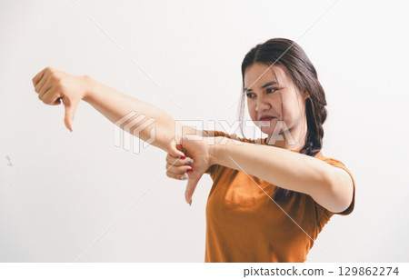 Asian girl expresses dislike, person express negative feeling, concept business complaint from customer ensuring employee satisfaction negative feedback to prevent mental strain customer dislike 129862274