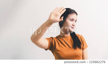 Asian girl expresses dislike, person express negative feeling, concept business complaint from customer ensuring employee satisfaction negative feedback to prevent mental strain customer dislike Asian girl expresses dislike, person express negative feeling, concept business complaint from customer ensuring employee satisfaction negative feedback to prevent mental strain customer dislike 129862276
