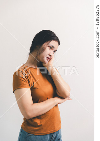 Asian girl expresses dislike, person express negative feeling, concept business complaint from customer ensuring employee satisfaction negative feedback to prevent mental strain customer dislike Asian girl expresses dislike, person express negative feeling, concept business complaint from customer ensuring employee satisfaction negative feedback to prevent mental strain customer dislike 129862278