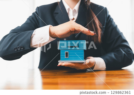 Home insurance and security concept. Real estate house insurance. Domino chain challenge risk. insurance risk management, property security, financial planning to safety, mortgage protect investment 129862361