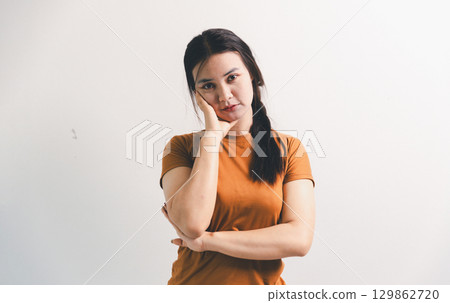 Asian girl expresses dislike, person express negative feeling, concept business complaint from customer ensuring employee satisfaction negative feedback to prevent mental strain customer dislike 129862720