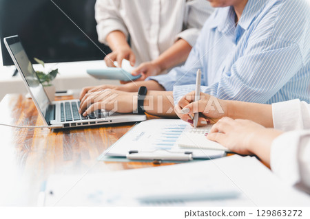 Teamwork meeting, business people in office workplace. Collaboration, technology and worker, employees with touchscreen planning sales, research or financial strategy, staff for conversation, graph 129863272