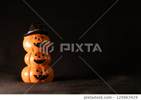 Jack O Lantern Pumpkins on Black Background Jack O Lantern Pumpkins on Black Background 129863429