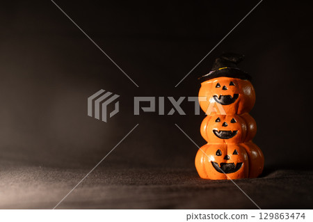 Halloween Pumpkin Stack with Witch Hat 129863474