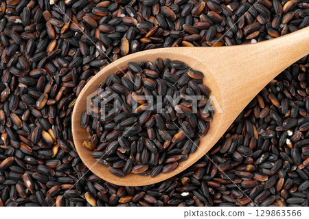 Close-up of black rice on a spoon Close-up of black rice on a spoon 129863566