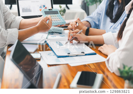 Teamwork meeting, business people in office workplace. Collaboration, technology and worker, employees with touchscreen planning sales, research or financial strategy, staff for conversation, graph 129863821