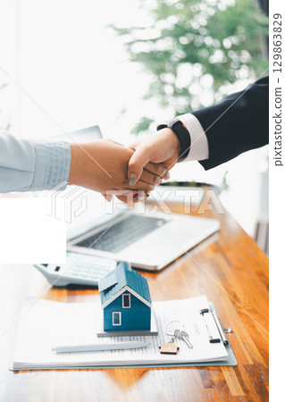 Business of finance, financial and banking investments in real estate buying, selling, purchasing commercial apartment. team meeting in office, growth concept, against background of banking ownership 129863829