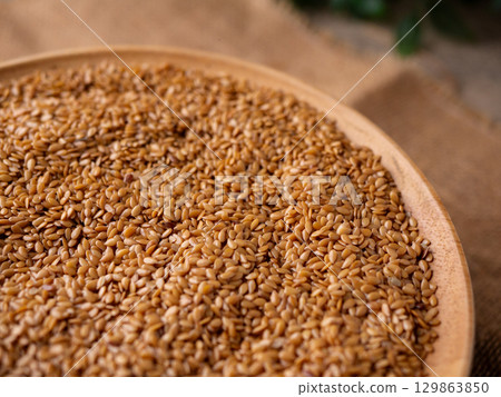 Organic golden flaxseed, linseed grains. Superfood high in fiber. 129863850