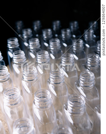 Row of plastic PET Bottles Production Line Ready for Bottling. Row of plastic PET Bottles Production Line Ready for Bottling. 129864007
