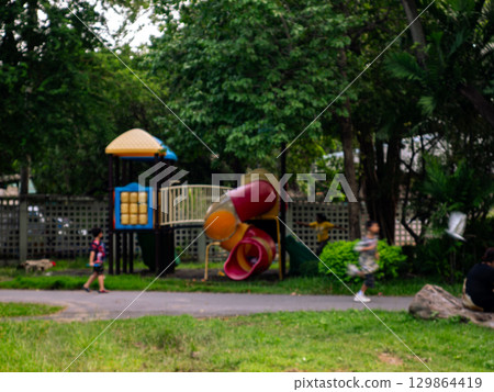 Blurred Playground in Public Park Background. Blurred Playground in Public Park Background. 129864419