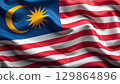 Malaysian flag waving in the wind: a symbol of national pride 129864896