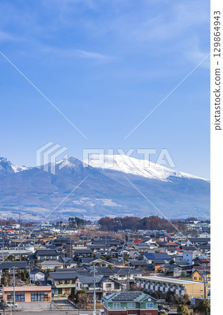 Snow-covered Mount Asama seen from Sakudaira 129864943