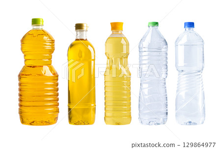 Vegetable oil with olive oil in different bottle for cooking isolated on white background. 129864977