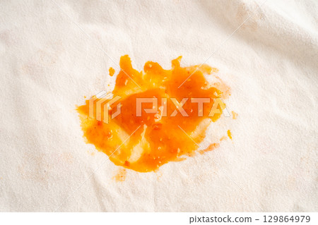 Dirty tomato sauce stain or ketchup on cloth to wash with washing powder, cleaning housework. Dirty tomato sauce stain or ketchup on cloth to wash with washing powder, cleaning housework. 129864979