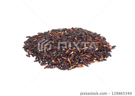 Black sticky rice pile isolated on white background 129865340