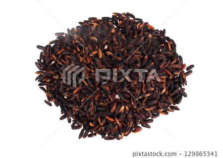 Black sticky rice pile isolated on white background 129865341