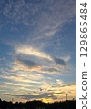 Clouds shining in the setting sun 129865484
