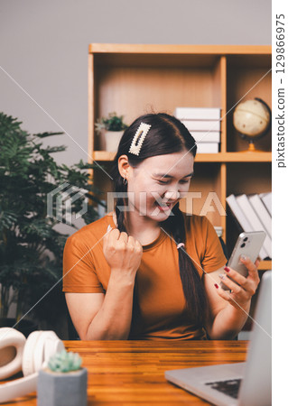 Homeschool Asian girl student learning virtual internet online class from school teacher by remote meeting. Female teaching math by headphone. education concept. student with computer study at school 129866975