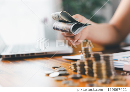 Business, finance and employment, entrepreneur and money concept. Successful young asian office manager, businesswoman showing earned cash, satisfied holding dollars, money dollar bills Business, finance and employment, entrepreneur and money concept. Successful young asian office manager, businesswoman showing earned cash, satisfied holding dollars, money dollar bills 129867421