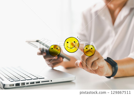 Customer showing rating with happy icon, Customer satisfaction survey concept, Positive feedback from happy client satisfaction with quality of service, marketing surveys, ratings, review, copy space Customer showing rating with happy icon, Customer satisfaction survey concept, Positive feedback from happy client satisfaction with quality of service, marketing surveys, ratings, review, copy space 129867511