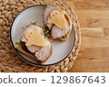 Happy Halloween! Ghost-shaped sandwiches with greens, meat, and cheese. 129867643