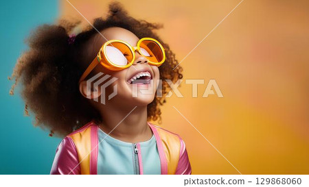 cute little girl in pink sunglasses 129868060